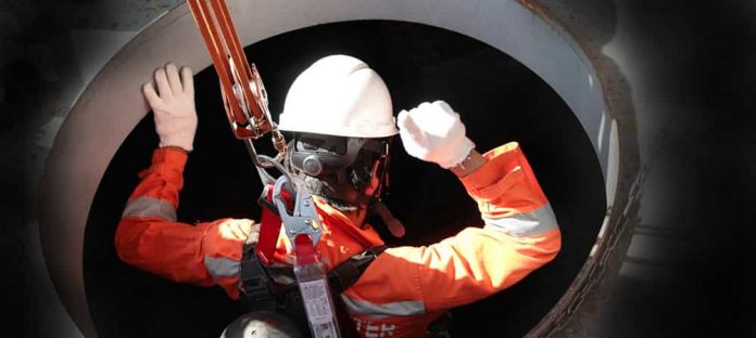Workman entering a Confined space