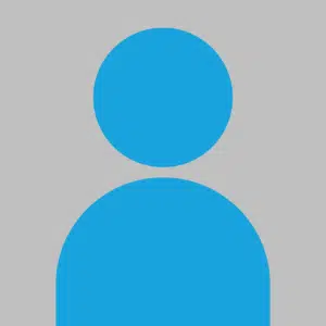 Basic Profile icon. Grey Background with blue circle and semi circle arranged to look like head and shoulders