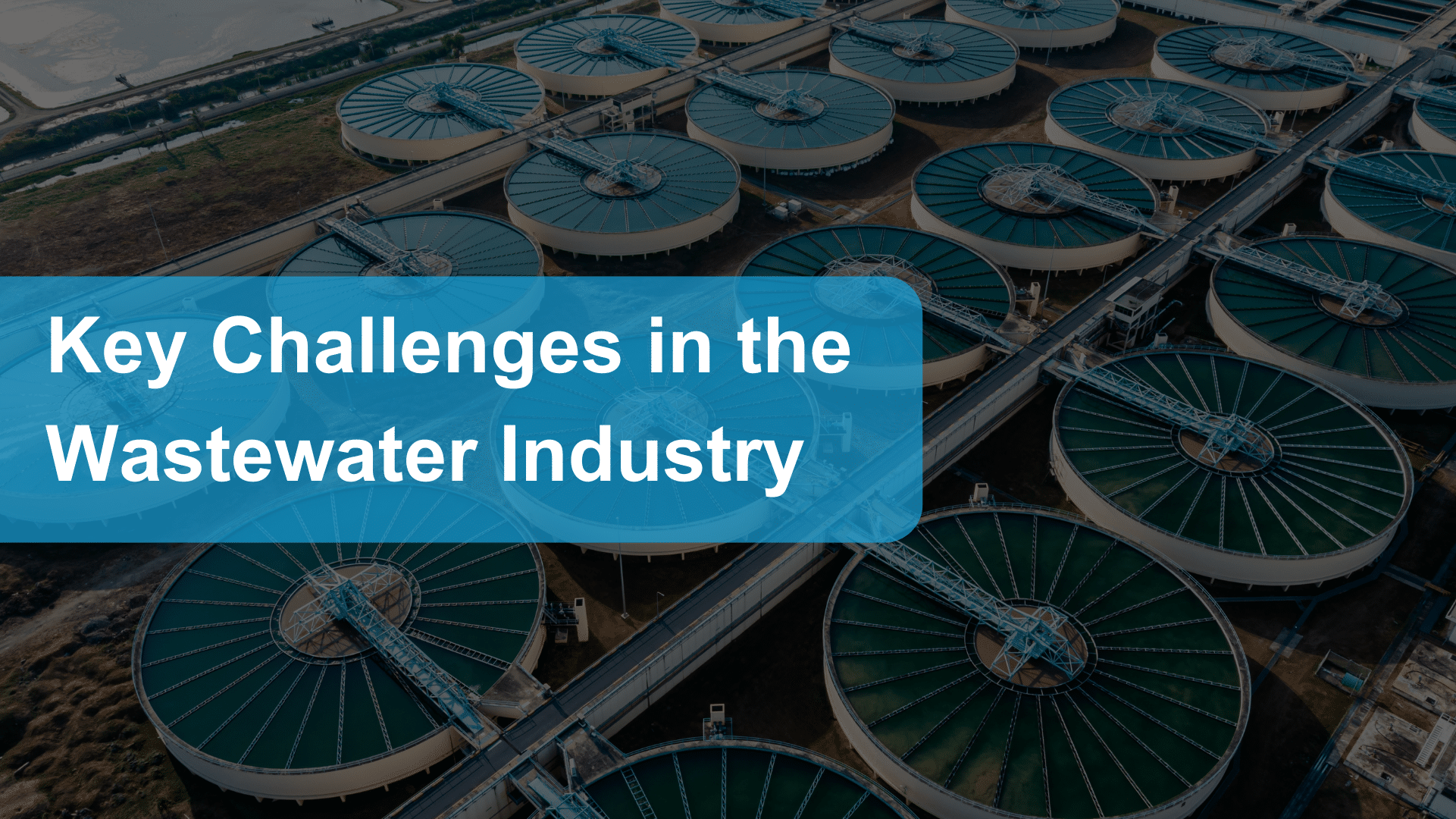 Key challenges in the wastewater industry title image: title in a blue box on a dark background showing an aerial image of a wastewater facility